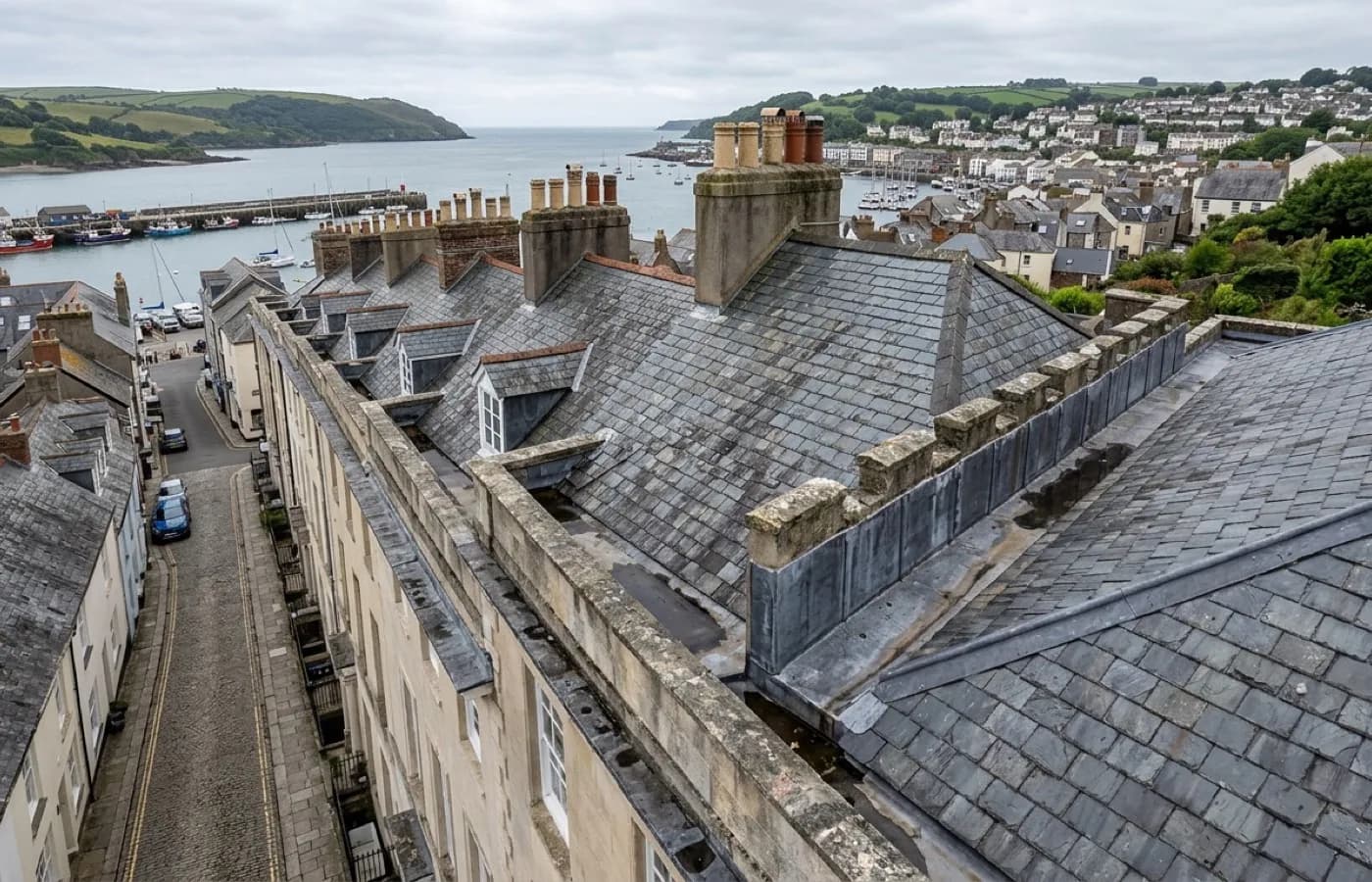 A Georgian and Regency terrace roofline with parapets and hidden lead-lined gutters running behind the coping